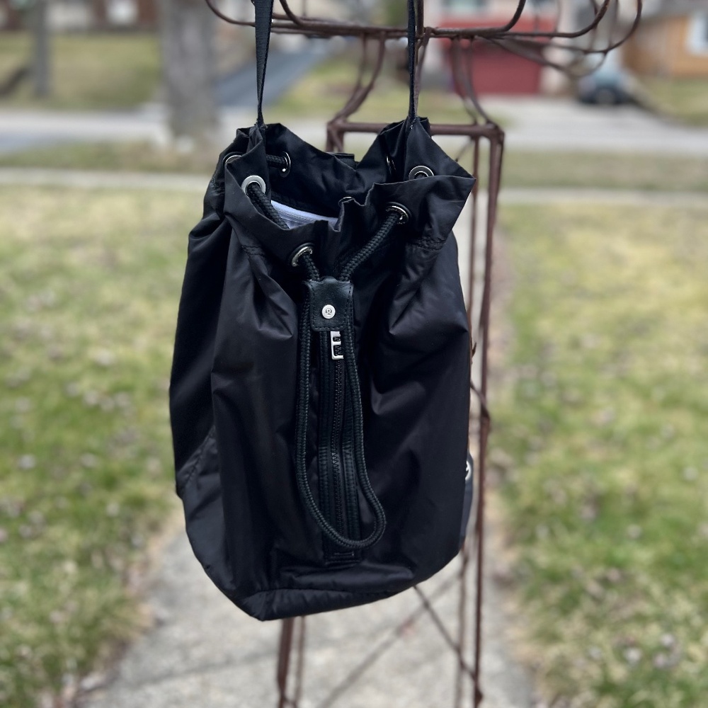 Lulu lemon black nylon workout/swim bag, lined in blue and white stripes